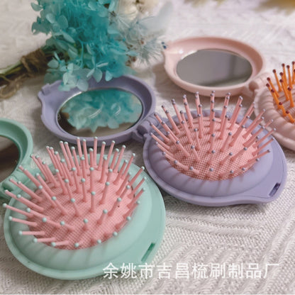 Macaron color cross -border hot -selling cartoon can fold the mini mirror combed mirror combine love